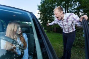 Image of neighbour arguing with a driver of a car Image of neighbour arguing with a driver of a car