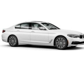 Side view of white BMW5 Series which is available for lease if you have bad credit